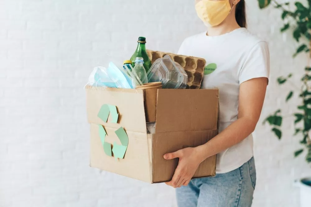 girl recycling packaging